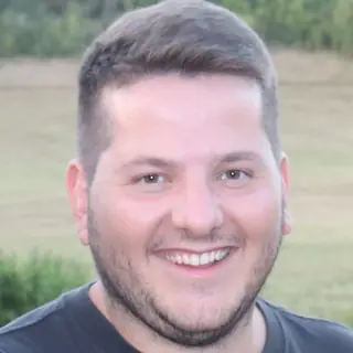 Mathis, smiling, outdoors